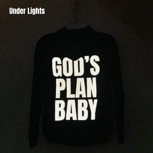 Light Reflecting Unisex Hoodie featuring bold reflective text under lights for stylish night wear