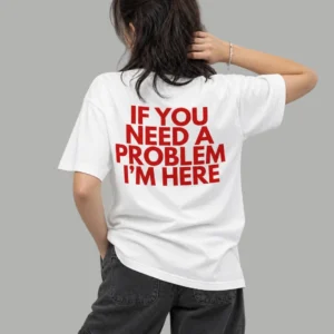 A girl wearing a white t-shirt with a print of if you need a problem I'm here from Zenith Lifestyle