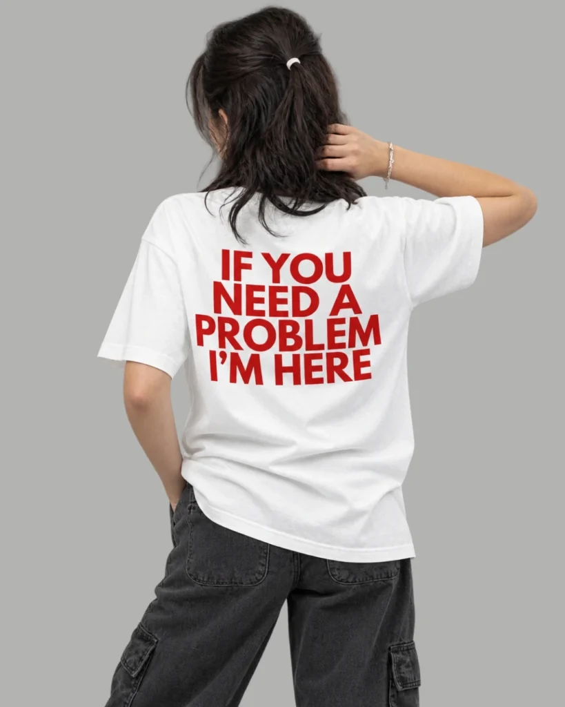 A girl wearing a white t-shirt with a print of if you need a problem I'm here from Zenith Lifestyle