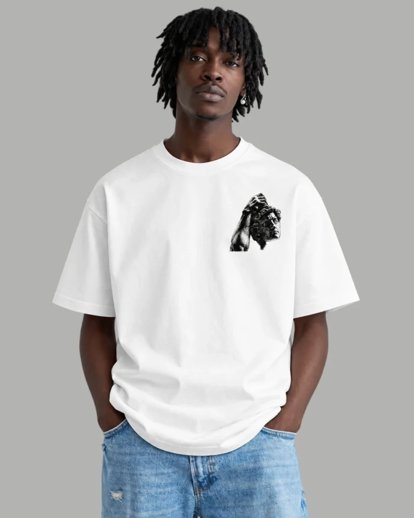 A model wearing a white oversized t-shirt with graphic design named Undefeatable from Zenith Lifestyle